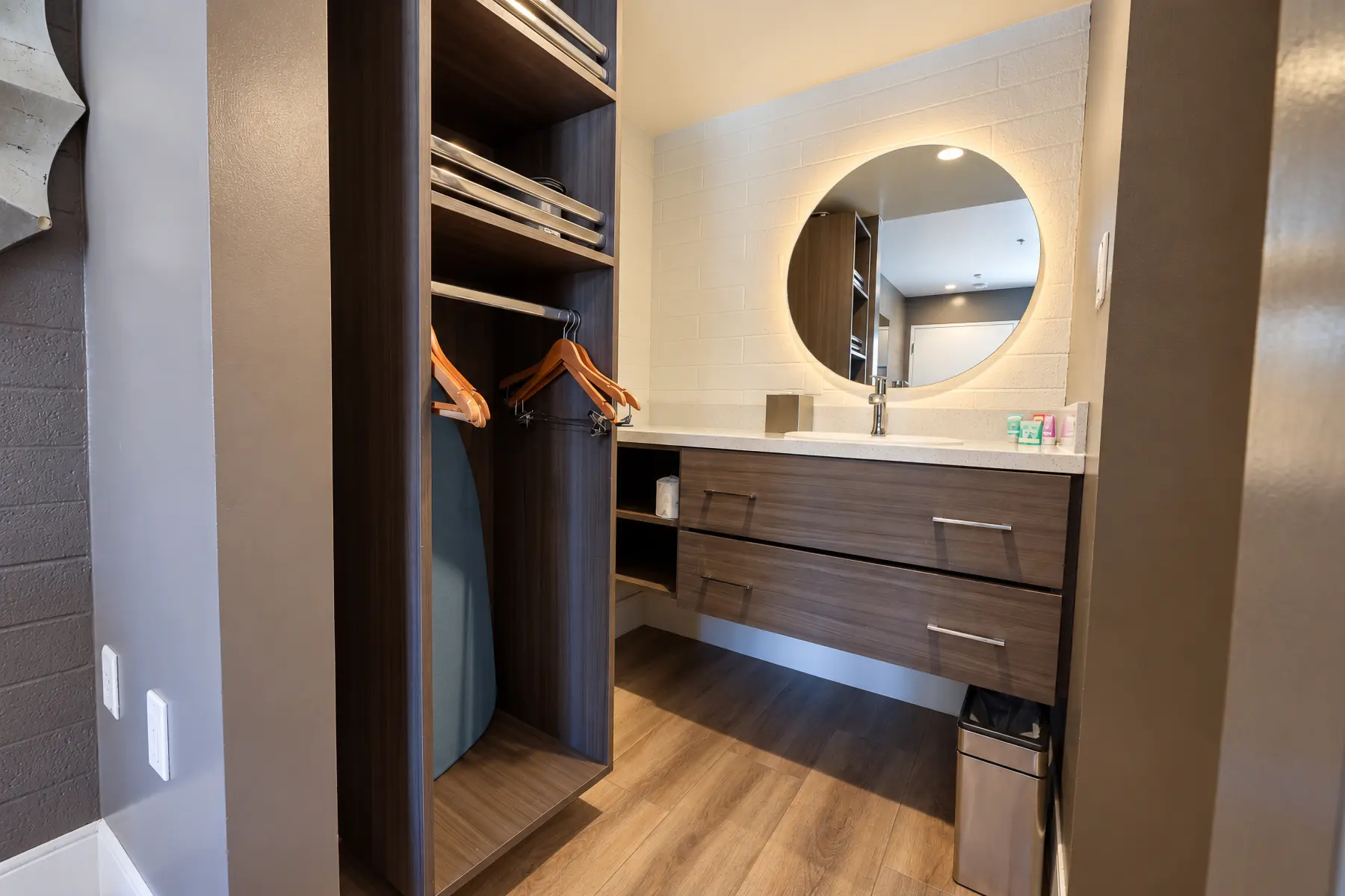 Closet with shelves, hangers and a vanity