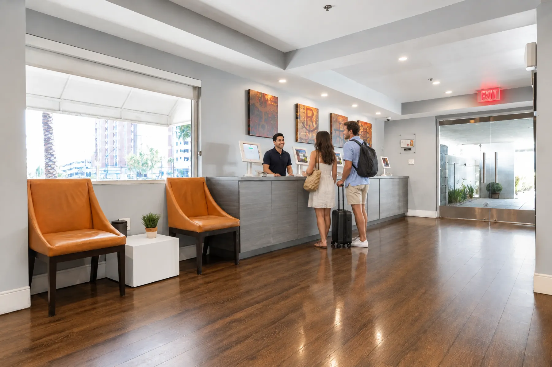 Guests checking in at the Oasis front desk